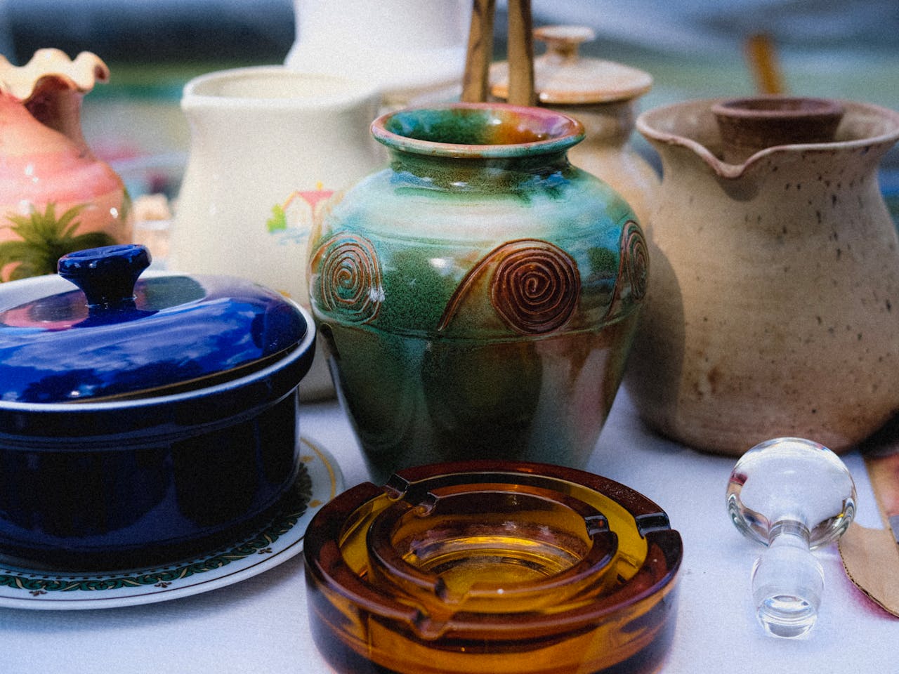services-03 A vibrant collection of ceramic and glass vases showcasing artistic designs.