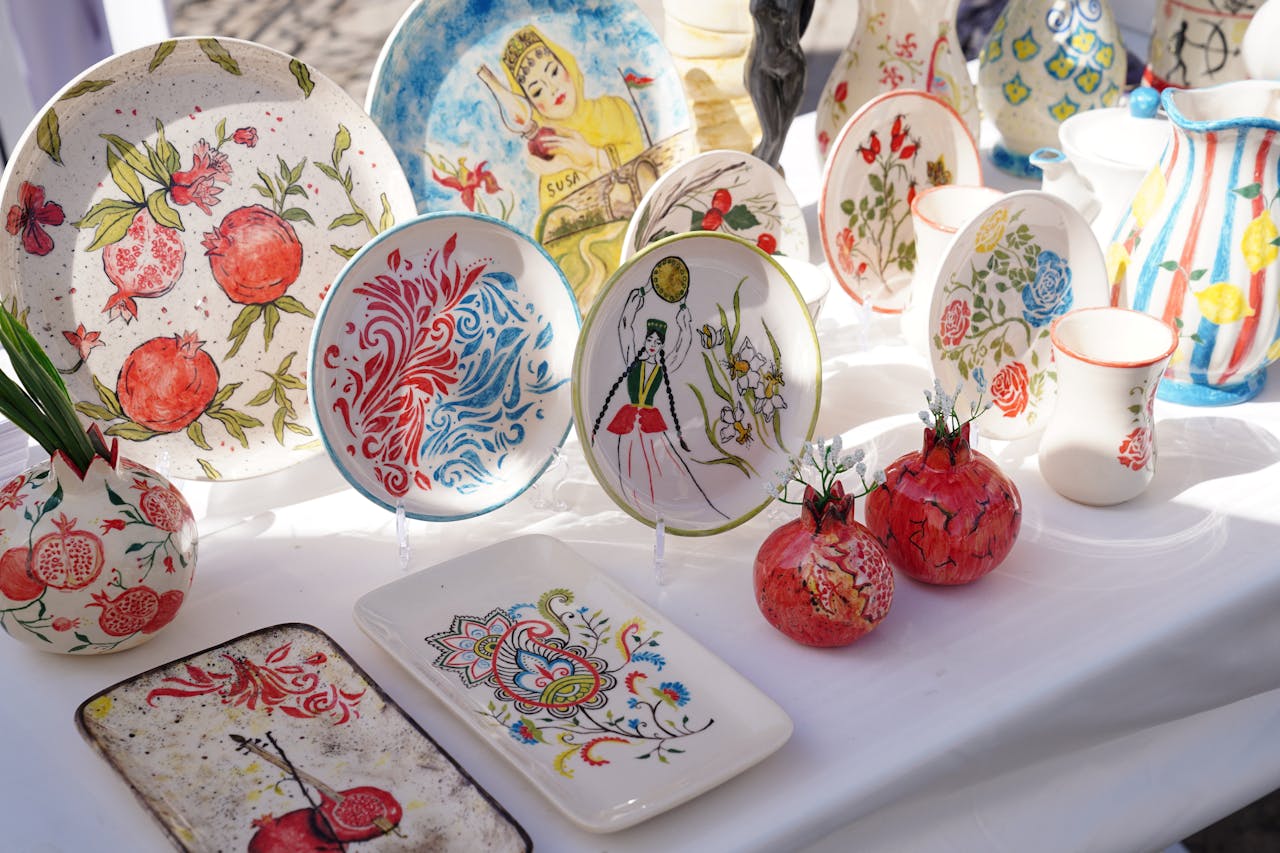 services-01 Vibrant Azerbaijani ceramic dishes showcasing traditional designs and patterns.